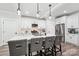 Kitchen featuring white cabinets, stainless steel appliances, and a central island with barstool seating at 127 Wickersham Dr, Statesville, NC 28625