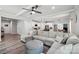 Open living area with modern decor, wood-look flooring, and seamless flow to the kitchen at 127 Wickersham Dr, Statesville, NC 28625