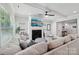 Inviting living space boasts natural light, a fireplace, and a comfortable sectional sofa at 127 Wickersham Dr, Statesville, NC 28625