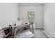 Office features a desk, an area rug, and a window providing natural light at 127 Wickersham Dr, Statesville, NC 28625