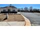 Clubhouse with black trim and view of the community pool in the background at 130 Parker Claire Ln, Kings Mountain, NC 28086