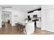 Modern kitchen featuring an island with stool seating, white cabinets, stainless steel appliances, and hardwood floors at 130 Parker Claire Ln, Kings Mountain, NC 28086