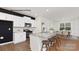 Well-equipped kitchen with island, white cabinets, stainless steel appliances, and an open layout to dining area at 130 Parker Claire Ln, Kings Mountain, NC 28086