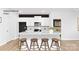 Modern kitchen features white cabinets, stainless steel appliances, and a large island with seating at 130 Parker Claire Ln, Kings Mountain, NC 28086