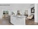 Bright open-concept kitchen with center island, stainless steel appliances, and seamless flow to living and dining areas at 130 Parker Claire Ln, Kings Mountain, NC 28086