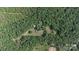 Aerial view featuring a property surrounded by a dense green forest with clearings at 1371 Hawks Nest Rd, York, SC 29745