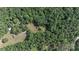 Aerial view of a property featuring lush green trees and partial clearing at 1371 Hawks Nest Rd, York, SC 29745