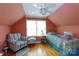 Cozy bedroom featuring a vintage-style bed, hardwood floors, chair, and natural light at 1371 Hawks Nest Rd, York, SC 29745