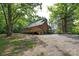 Charming exterior view of a single-Gathering home with a wood deck and lush greenery surrounding the property at 1371 Hawks Nest Rd, York, SC 29745