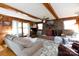 Inviting living room featuring a brick fireplace and wood paneled wall at 1371 Hawks Nest Rd, York, SC 29745