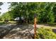 Functional outbuilding in a wooded area, featuring a metal roof, gravel lot and covered bay at 1371 Hawks Nest Rd, York, SC 29745