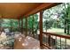 Spacious covered porch offering serene outdoor living with views of the lush surrounding landscape at 1371 Hawks Nest Rd, York, SC 29745