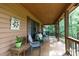 Relaxing covered porch with comfortable seating, decorative accents, and a welcoming ambiance at 1371 Hawks Nest Rd, York, SC 29745