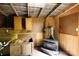 Workshop area includes pegboard walls, cabinets and wood stove at 1371 Hawks Nest Rd, York, SC 29745