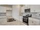 Close-up view of the stainless steel oven and sink in this kitchen with granite countertops at 150 Parker Claire Ln, Kings Mountain, NC 28086