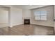 Bright living room with hardwood floors, fireplace, and natural light at 150 Parker Claire Ln, Kings Mountain, NC 28086