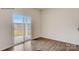 Bright living room featuring hardwood floors and a sliding glass door with access to a patio at 150 Parker Claire Ln, Kings Mountain, NC 28086