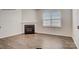 Living room with hardwood floors, a fireplace, and a bright window at 150 Parker Claire Ln, Kings Mountain, NC 28086
