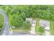 An aerial view of the house showcasing its location on a tree-lined street in a residential neighborhood at 152 Hampshire Dr, Mooresville, NC 28115