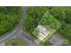 An aerial view of the home and property highlighting the lush surrounding greenery at 152 Hampshire Dr, Mooresville, NC 28115