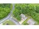 Bird's-eye view of the house showcasing the surrounding trees and the layout of the property at 152 Hampshire Dr, Mooresville, NC 28115