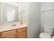 Neutral half bath with a vanity and mirror at 152 Hampshire Dr, Mooresville, NC 28115