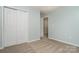 Bedroom featuring closet and doorway, creating a welcoming and functional space for relaxation and storage at 152 Hampshire Dr, Mooresville, NC 28115