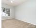 Clean bedroom with window providing natural light, offering a comfortable and serene living space at 152 Hampshire Dr, Mooresville, NC 28115