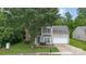 Charming two-story home showcasing neutral siding, brick accents, an attached two-car garage, and a tidy front lawn at 152 Hampshire Dr, Mooresville, NC 28115