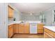 Bright kitchen with wooden cabinets, laminate countertops, and lots of natural light at 152 Hampshire Dr, Mooresville, NC 28115