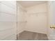 Spacious walk-in closet with multiple shelves for organized storage and easy access to clothing and accessories at 152 Hampshire Dr, Mooresville, NC 28115