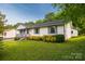 Charming one-story home featuring a well-maintained lawn and colorful landscaping at 1613 Hamilton St, Charlotte, NC 28206