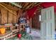 Cluttered garage with tools, equipment, and an open wooden ceiling at 1613 Hamilton St, Charlotte, NC 28206