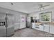 Bright kitchen featuring modern appliances and window with lush green view at 1613 Hamilton St, Charlotte, NC 28206