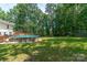 Expansive green backyard featuring a deck and an above ground pool at 1739 Lesa Lin Dr, Monroe, NC 28112