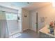 Bathroom with tiled shower, grab bar, vanity with storage, and natural light at 1739 Lesa Lin Dr, Monroe, NC 28112