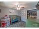 Bedroom with a green baby crib, a rocket tent, and a ceiling fan at 1739 Lesa Lin Dr, Monroe, NC 28112