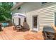 Outdoor deck features an umbrella covered picnic table and a gas grill at 1739 Lesa Lin Dr, Monroe, NC 28112