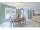Charming dining area with tiled floor, lots of natural light and access to the backyard and kitchen at 1739 Lesa Lin Dr, Monroe, NC 28112