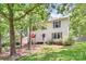 Two-story home with lawn surrounded by mature trees at 1739 Lesa Lin Dr, Monroe, NC 28112