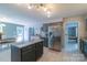 Open Kitchen featuring stainless steel refrigerator, granite countertops and an island at 1739 Lesa Lin Dr, Monroe, NC 28112