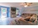 Spacious living room includes a comfortable sectional sofa, fireplace with TV, and access to the backyard deck at 1739 Lesa Lin Dr, Monroe, NC 28112