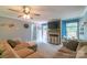Bright and airy living room with a cozy sectional sofa, fireplace and TV, and access to the backyard at 1739 Lesa Lin Dr, Monroe, NC 28112