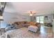 Comfortable living room features a large sectional sofa, cozy rug and staircase access at 1739 Lesa Lin Dr, Monroe, NC 28112