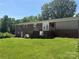 Spacious backyard featuring a brick exterior with a balcony perfect for outdoor relaxation and entertainment at 1821 Beaman St, Shelby, NC 28152