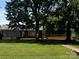 Charming brick home with mature trees and a well-maintained front lawn, creating a welcoming curb appeal at 1821 Beaman St, Shelby, NC 28152