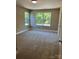 Bright, carpeted bedroom with plenty of natural light and neutral paint at 183 Pine Haven Rd, Statesville, NC 28677