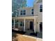 Inviting front porch featuring stately white columns and charming outdoor lighting at 183 Pine Haven Rd, Statesville, NC 28677