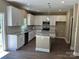 Modern kitchen featuring granite countertops, stainless steel appliances, and white cabinetry at 183 Pine Haven Rd, Statesville, NC 28677