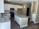 Spacious kitchen with an island, granite countertops and stainless steel appliances at 183 Pine Haven Rd, Statesville, NC 28677
